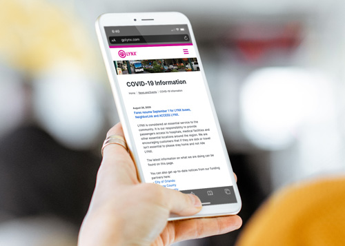 Person checking LYNX website in a mobile phone
